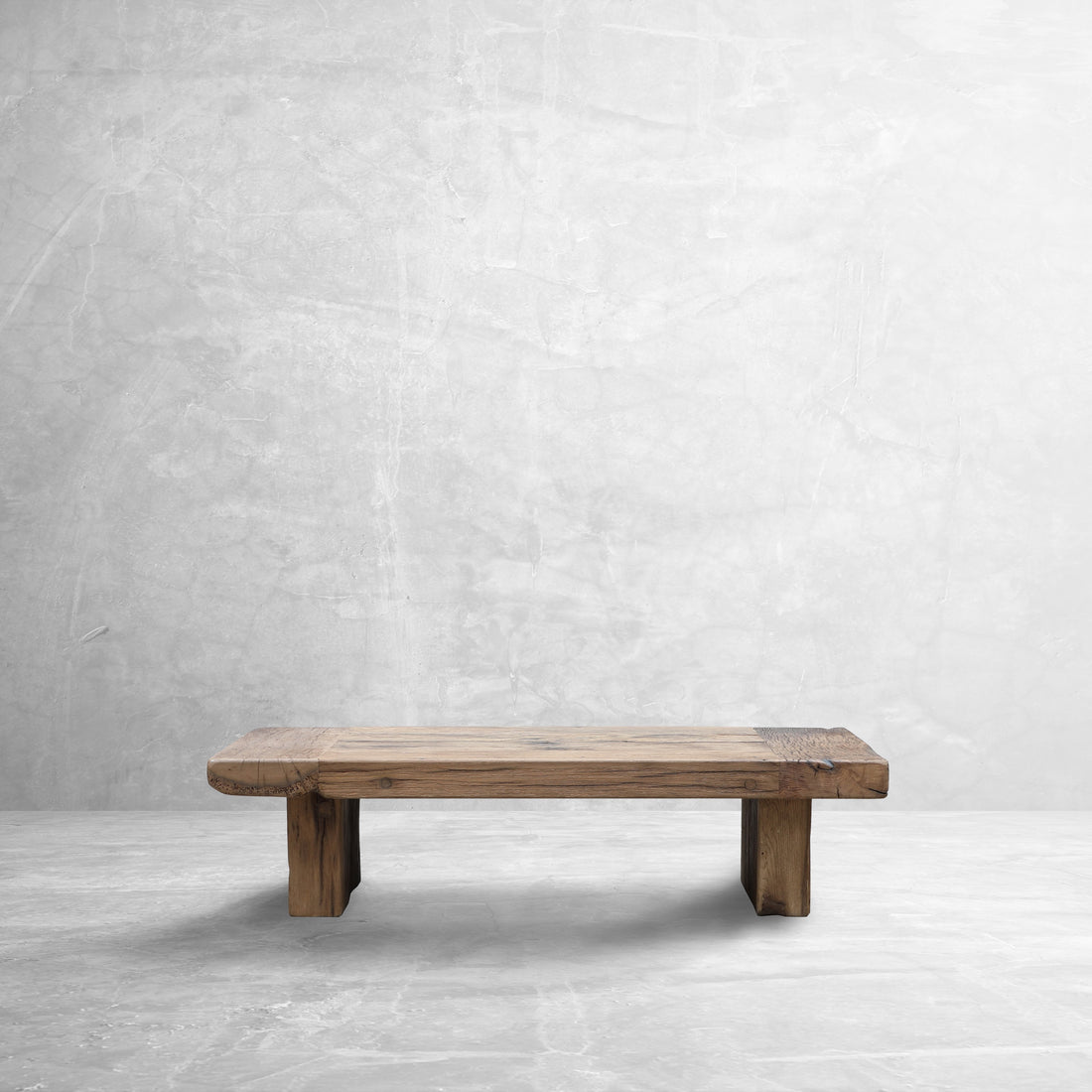 The ROTO Foundry RIFT Reclaimed Oak Coffee Table in a stone room